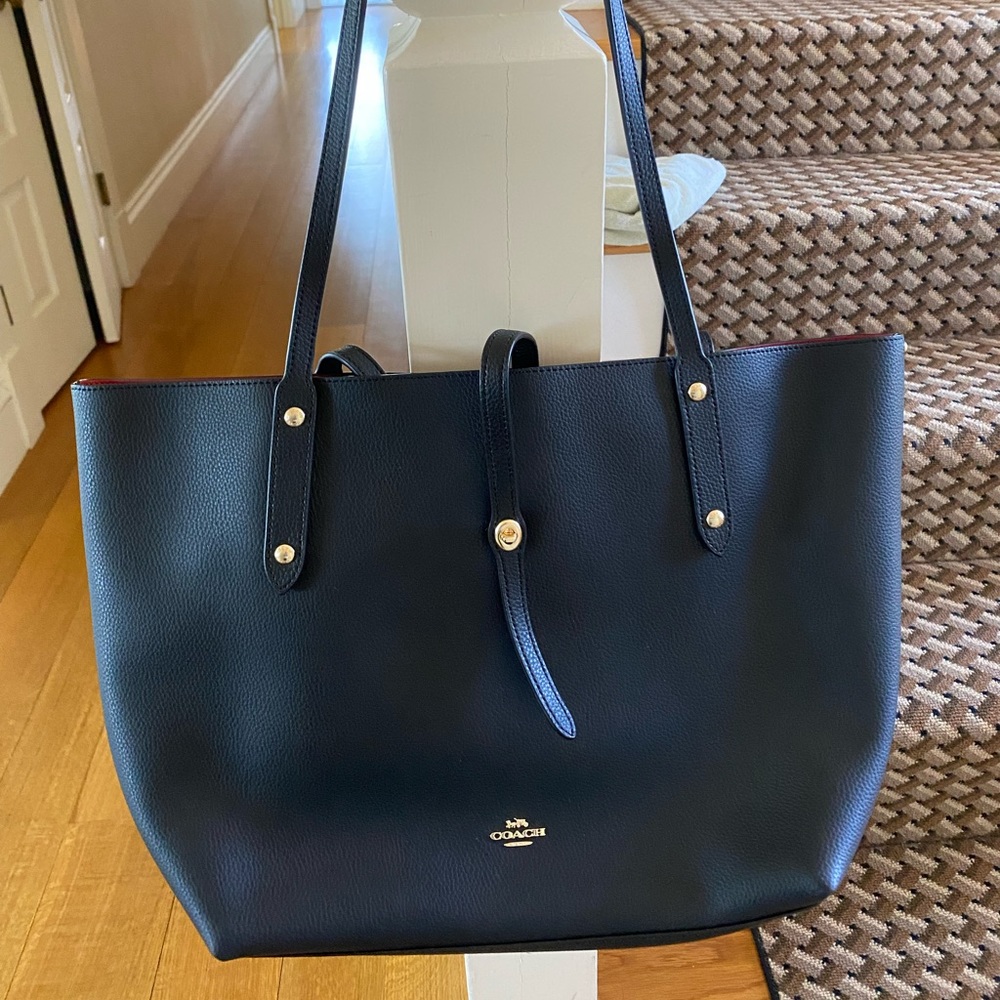 Brand new black bag, tags still on. Never been worn